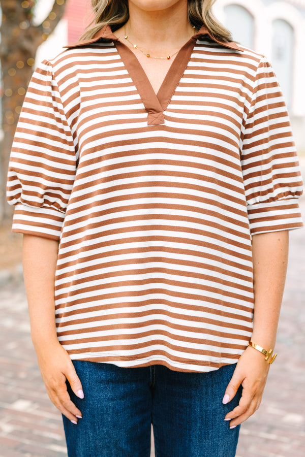 Plus Size brown and white striped popover top with a v-neck collar and short puff sleeves.