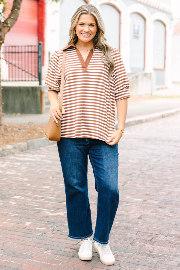 Plus Size brown and white striped popover top with a v-neck collar and short puff sleeves.