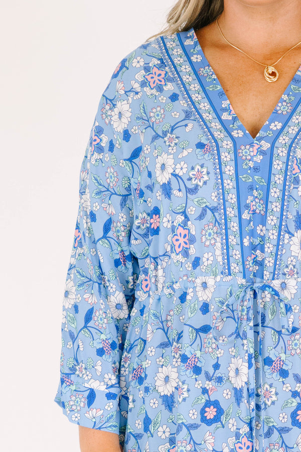 Plus Size blue floral maxi dress with long sleeves, a V-neckline, and tassel drawstring waist.