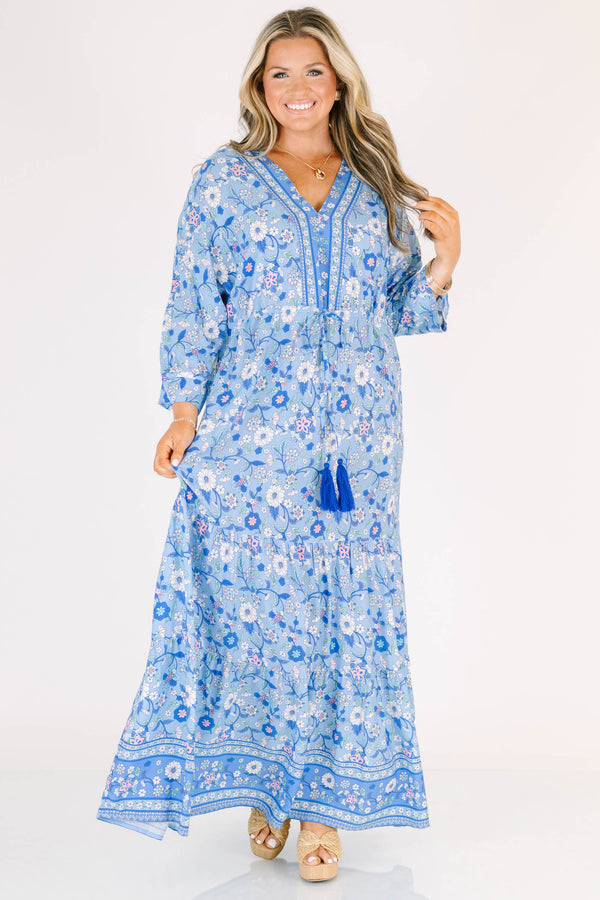 Plus Size blue floral maxi dress with long sleeves, a V-neckline, and tassel drawstring waist.