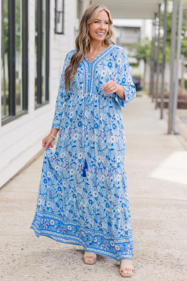 Plus Size blue floral maxi dress with long sleeves, a V-neckline, and tassel drawstring waist.