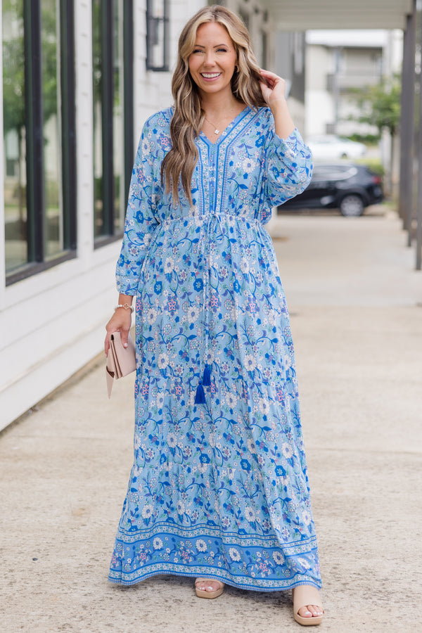 Plus Size blue floral maxi dress with long sleeves, a V-neckline, and tassel drawstring waist.