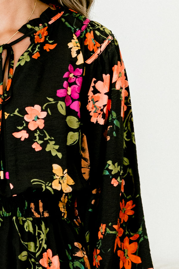 Chic Soul plus size clothing, black baby doll dress with long sleeves and a multi-color floral pattern throughout the dress 
