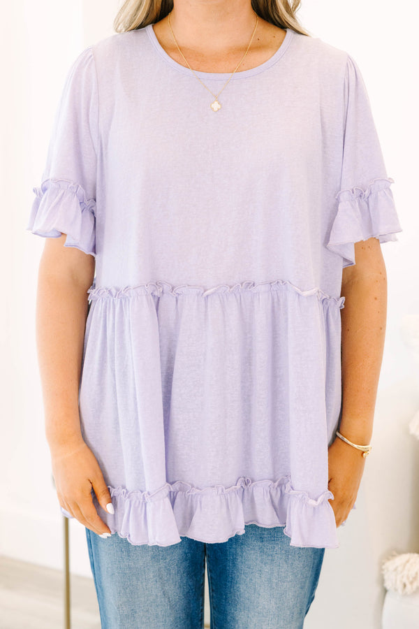 Plus Size purple babydoll top with ruffle trim on the short sleeves, waistline, and hem.