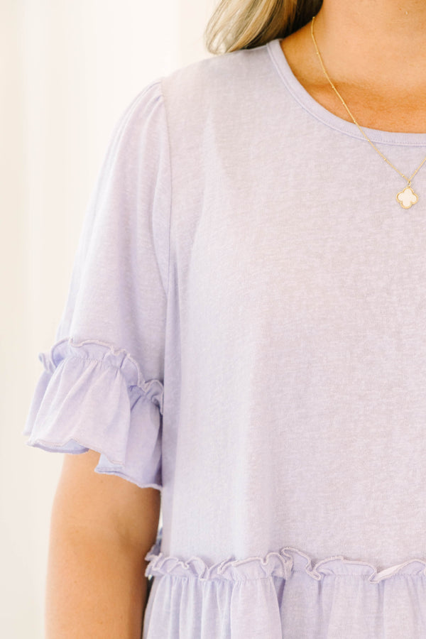 Plus Size purple babydoll top with ruffle trim on the short sleeves, waistline, and hem.
