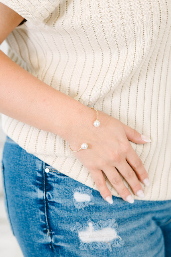 Gold-tone Gilded Pearl Bracelet with two white pearls on an open cuff design.