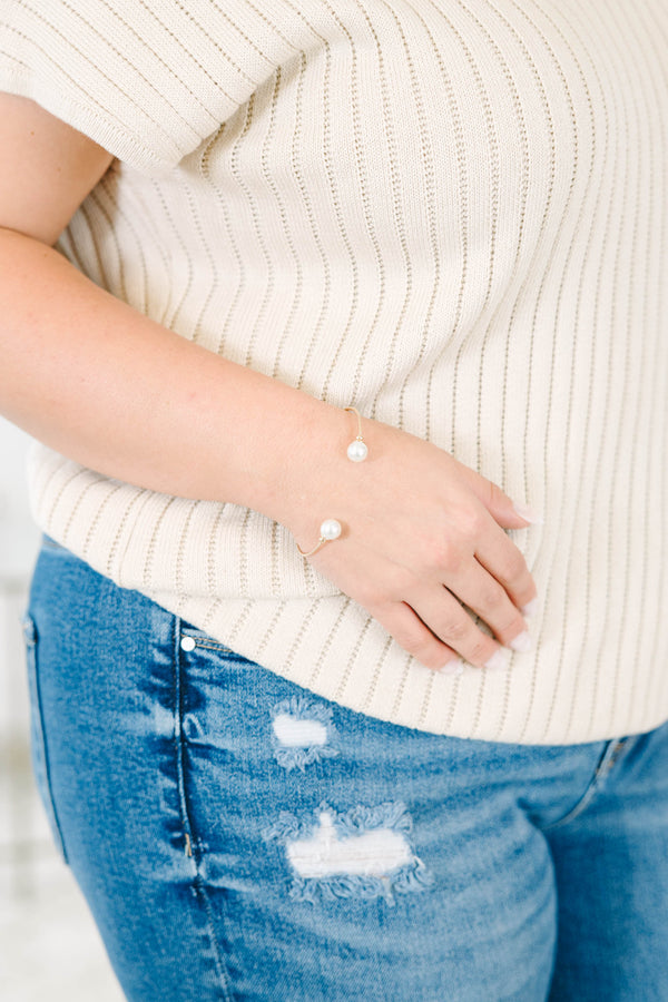 Gold-tone Gilded Pearl Bracelet with two white pearls on an open cuff design.