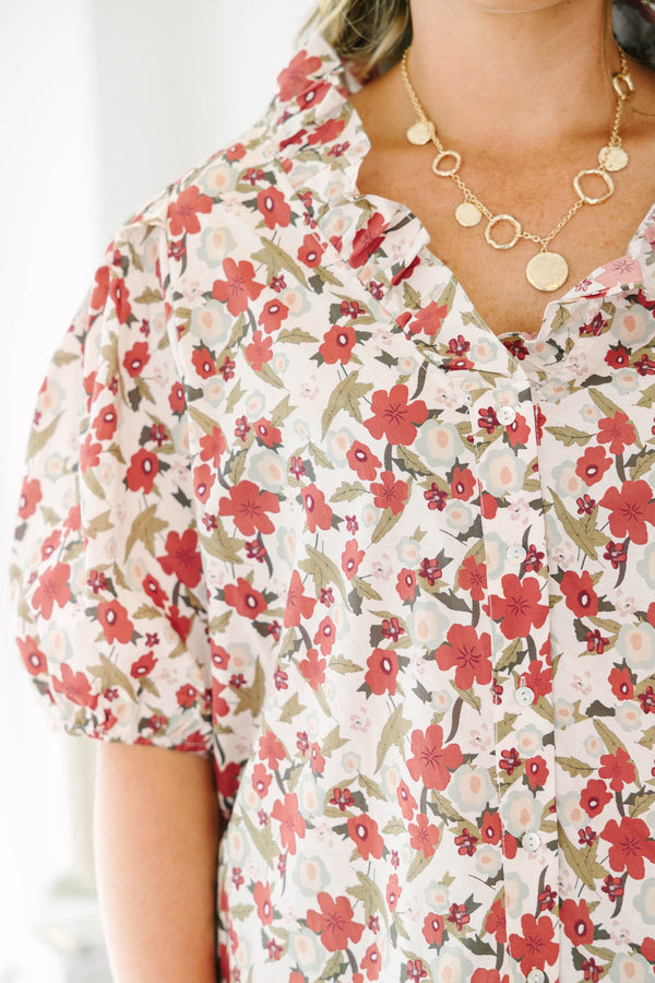 Plus Size red floral print top with a ruffled neckline, button-down front, and puff sleeves.