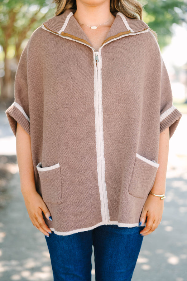 Plus Size brown zip-up knit poncho sweater with white trim, front pockets, and a wide collar.