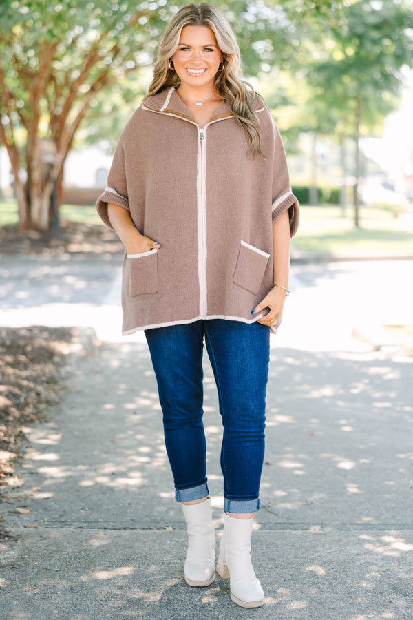 Plus Size brown zip-up knit poncho sweater with white trim, front pockets, and a wide collar.