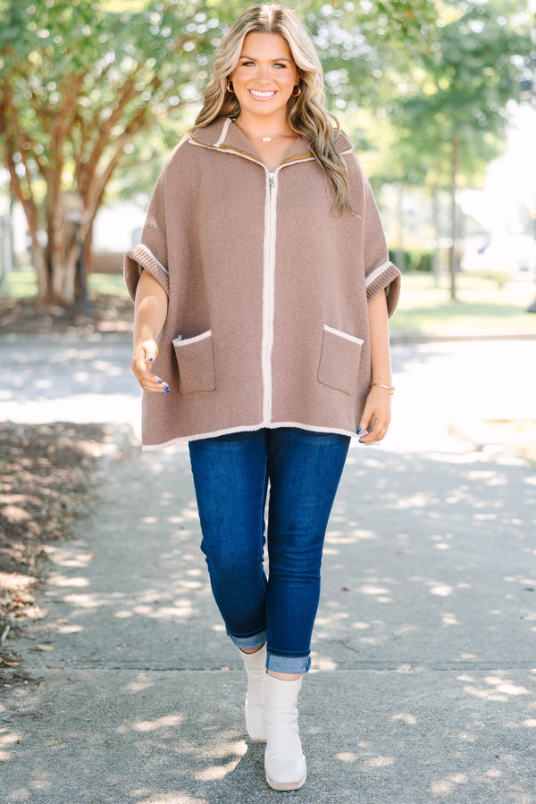 Plus Size brown zip-up knit poncho sweater with white trim, front pockets, and a wide collar.