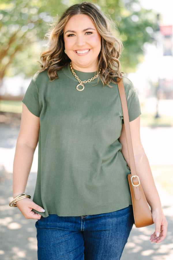 Plus Size olive green short sleeve sweater with a crew neckline and ribbed knit texture.