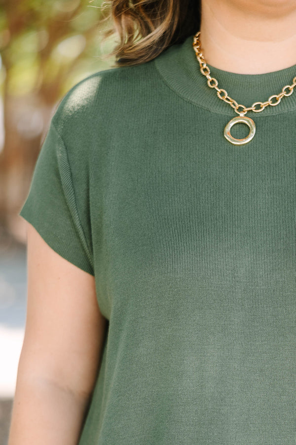 Plus Size olive green short sleeve sweater with a crew neckline and ribbed knit texture.