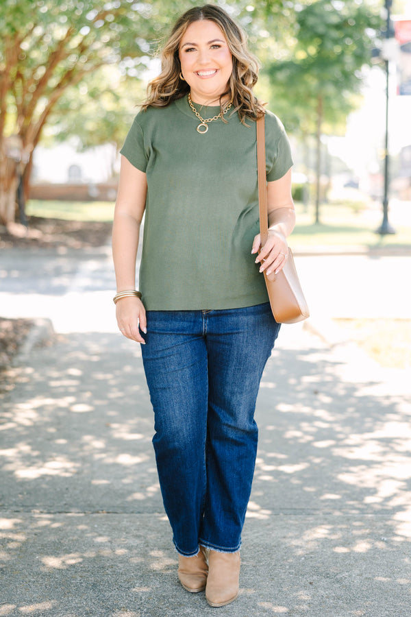Plus Size olive green short sleeve sweater with a crew neckline and ribbed knit texture.