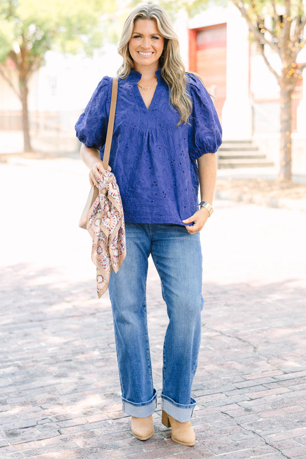 Plus Size medium wash straight leg jeans with front patch pockets and cuffed hems.
