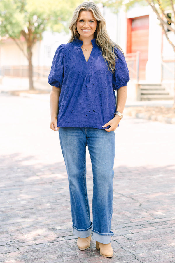Plus Size medium wash straight leg jeans with front patch pockets and cuffed hems.