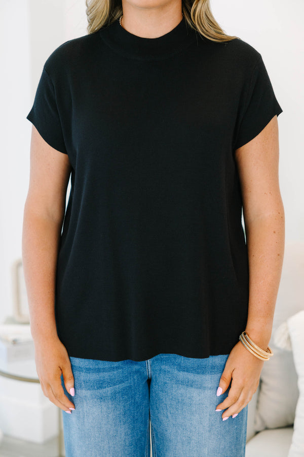 Plus Size short sleeve black knit sweater with a mock neckline and relaxed fit.