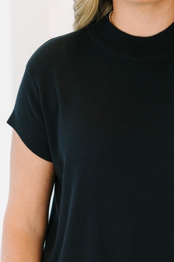Plus Size short sleeve black knit sweater with a mock neckline and relaxed fit.