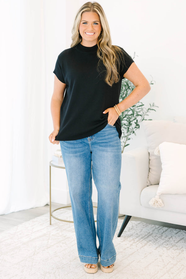 Plus Size short sleeve black knit sweater with a mock neckline and relaxed fit.