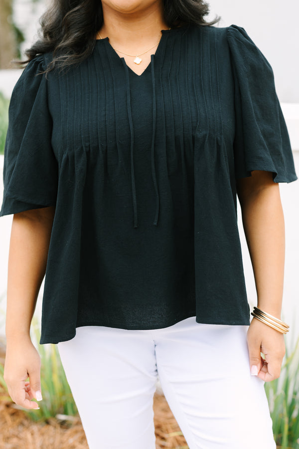 Chic Soul plus size clothing, black top with short sleeves a slight v-neckline and rouching along the chest area 