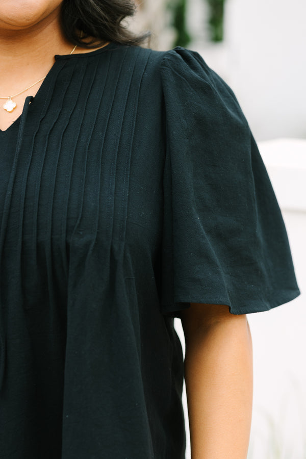Chic Soul plus size clothing, black top with short sleeves a slight v-neckline and rouching along the chest area 