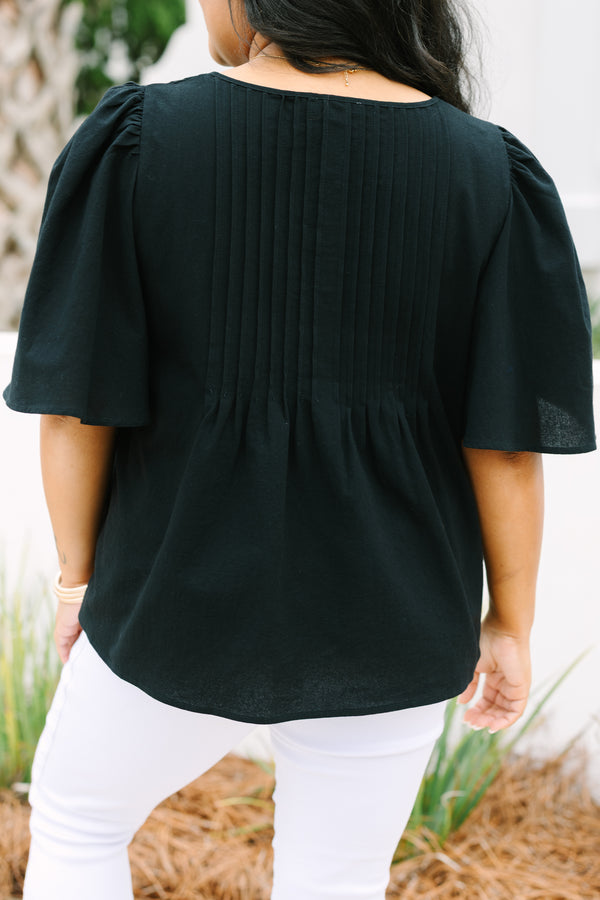 Chic Soul plus size clothing, black top with short sleeves a slight v-neckline and rouching along the chest area 