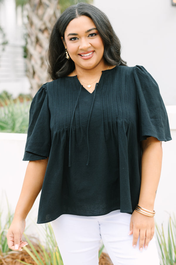 Chic Soul plus size clothing, black top with short sleeves a slight v-neckline and rouching along the chest area 
