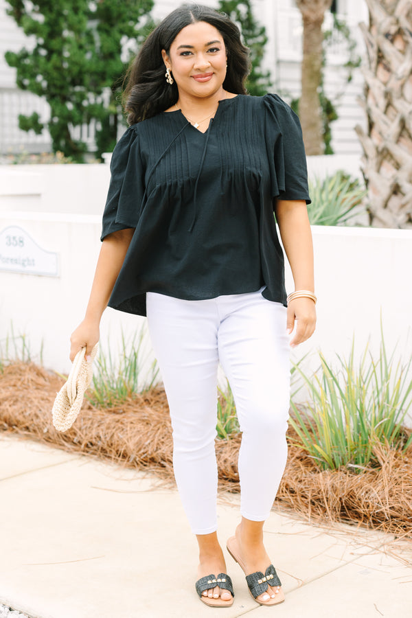 Chic Soul plus size clothing, black top with short sleeves a slight v-neckline and rouching along the chest area 