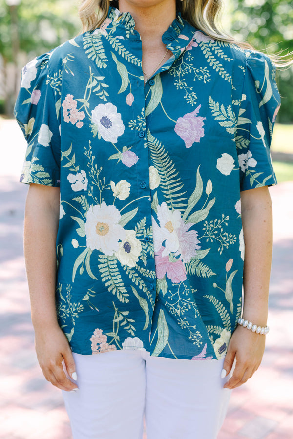 Plus size teal floral button-down top with short puff sleeves and a flowy, feminine fit.