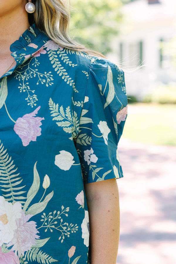 Plus size teal floral button-down top with short puff sleeves and a flowy, feminine fit.