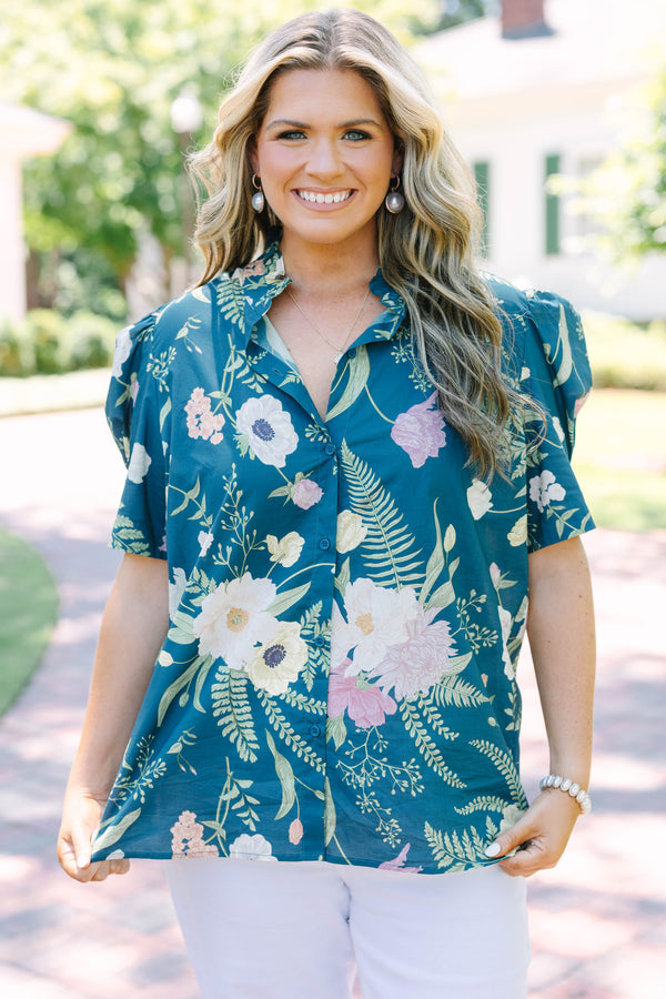 Plus size teal floral button-down top with short puff sleeves and a flowy, feminine fit.
