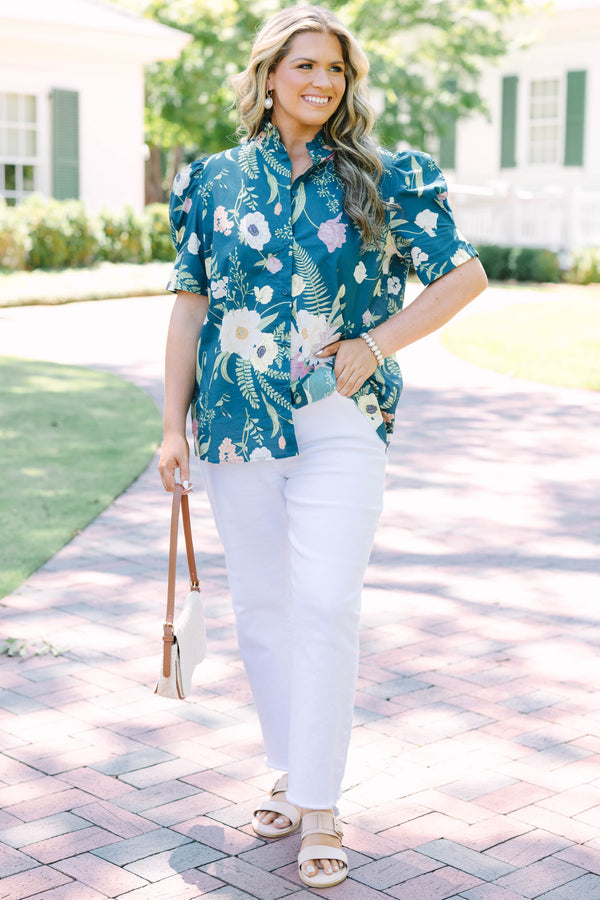 Plus size teal floral button-down top with short puff sleeves and a flowy, feminine fit.