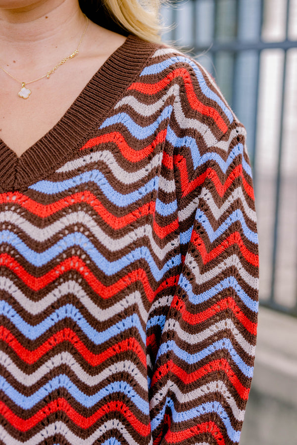 Chic Soul plus size clothing, brown-multi long sleeve sweater with a brown red and blue wavy pattern  and a slight v-neckline