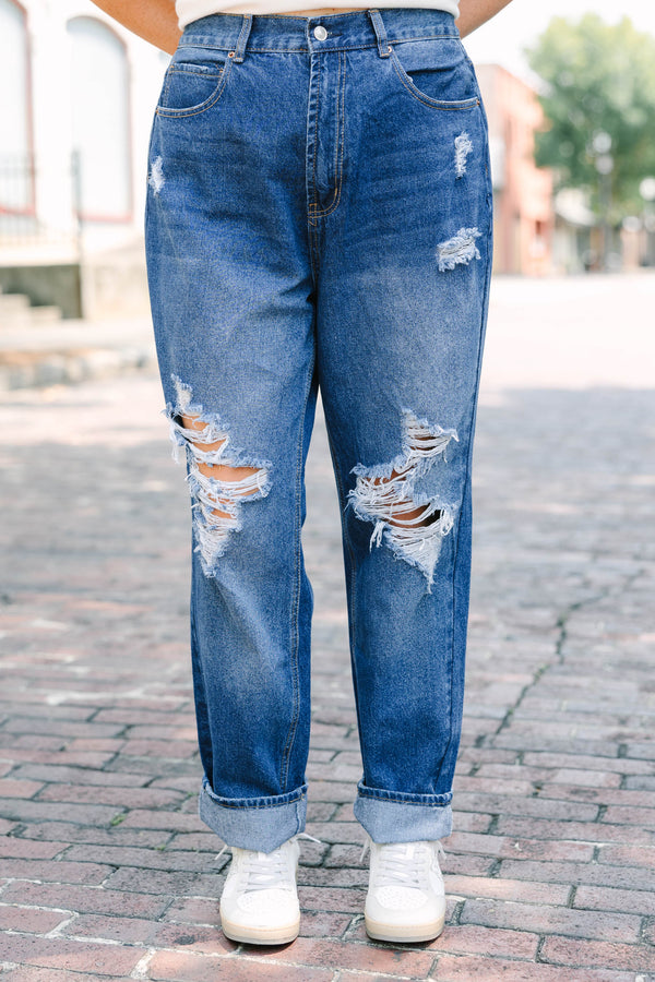 Plus Size dark wash high-rise jeans with heavy distressing
