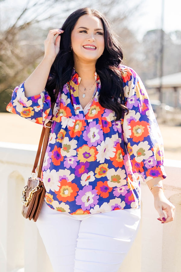 Chic Soul plus size clothing, three quarter length sleeve navy-purple top with cuff sleeves and v cutout along neckline with large multi floral print