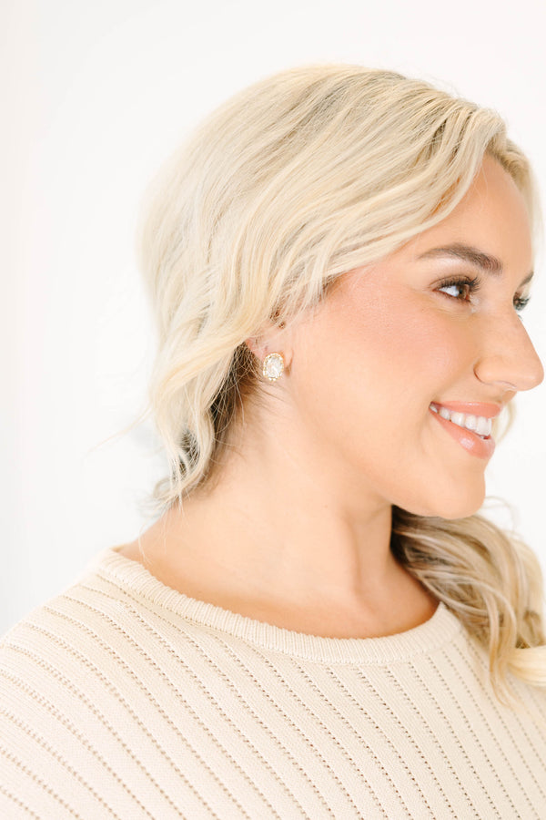 Plus Size oval faceted crystal earring set in a polished gold-plated brass frame.