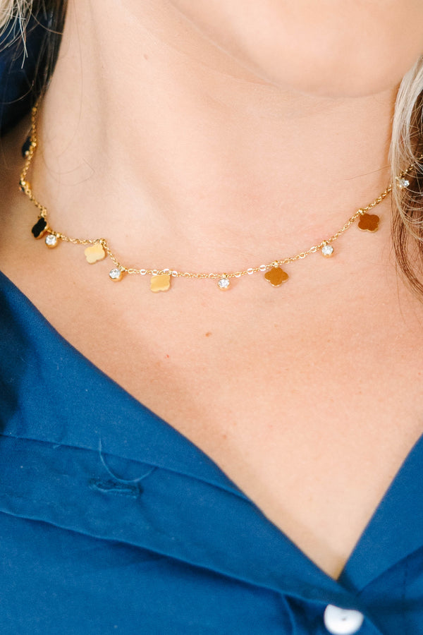 Plus Size gold-tone choker necklace with flat clover motifs and sparkling crystal drop charms.