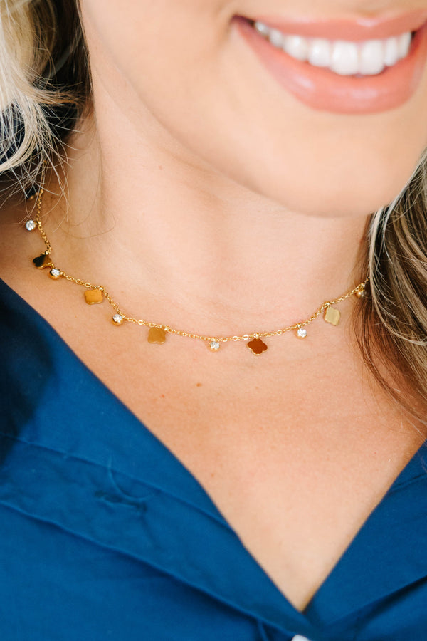 Plus Size gold-tone choker necklace with flat clover motifs and sparkling crystal drop charms.