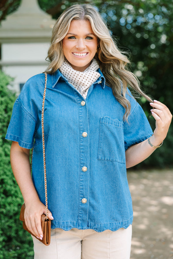 Plus size short-sleeve denim shirt with statement buttons, scalloped pocket, and a relaxed fit.