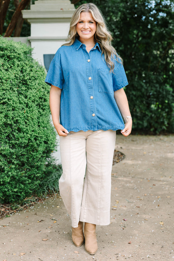 Plus size short-sleeve denim shirt with statement buttons, scalloped pocket, and a relaxed fit.