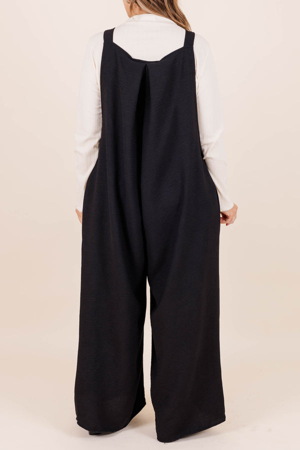 Chic Soul plus size clothing, black full length flowy jumpsuit with adjustable straps and triangle shape front seam detail