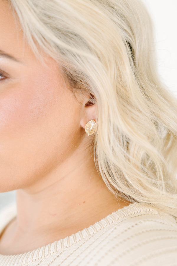 Textured gold leaf-shaped stud earrings
