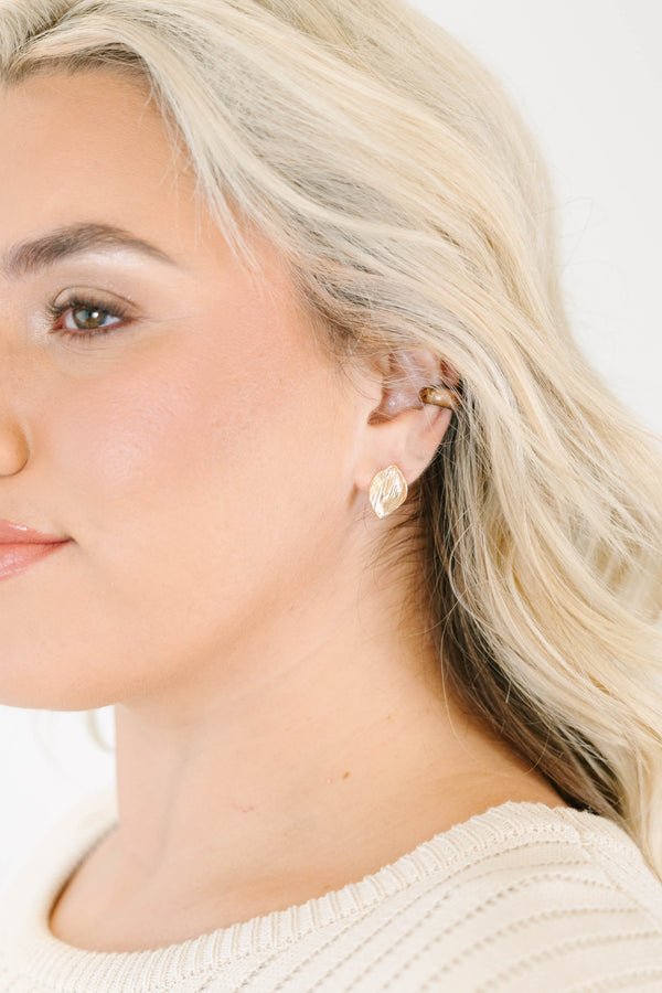 Textured gold leaf-shaped stud earrings