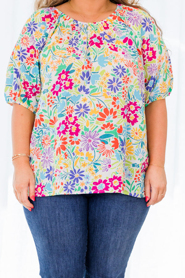 Plus Size multi-colored floral print top with bubble sleeves and a textured fabric.