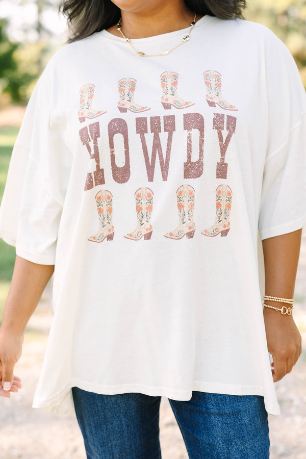 Plus size ivory boyfriend tee with 'HOWDY' and floral cowboy boots in a flowy 100% cotton fit.