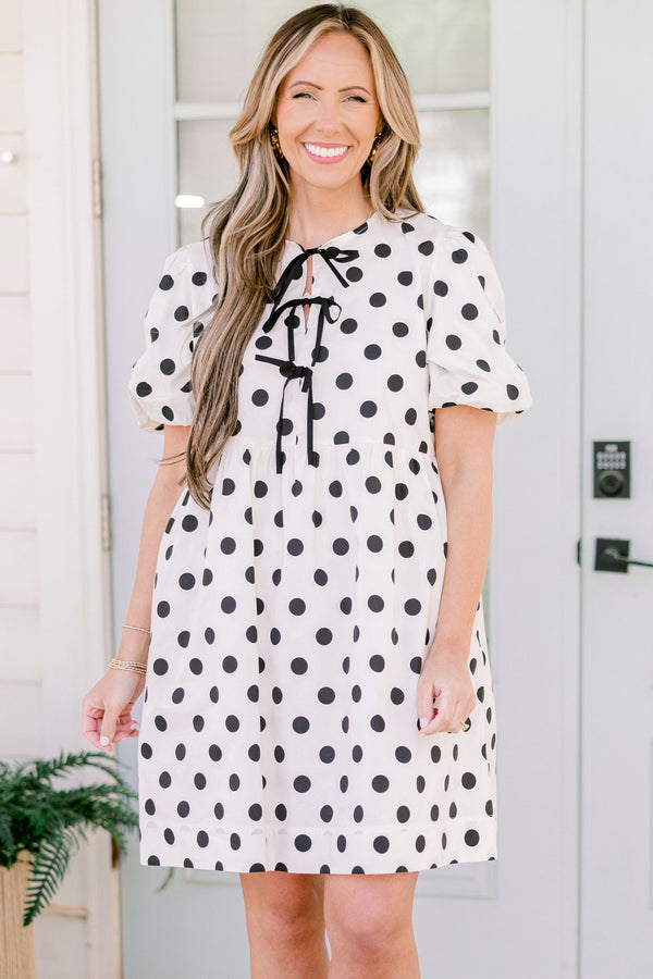 Chic Soul plus size clothing, short-puffed-sleeve white flowy short baby doll dress with black polka dots and black tied bows on the neckline