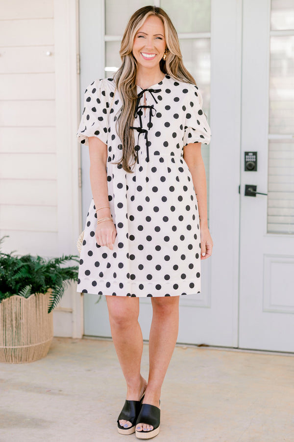 Chic Soul plus size clothing, short-puffed-sleeve white flowy short baby doll dress with black polka dots and black tied bows on the neckline