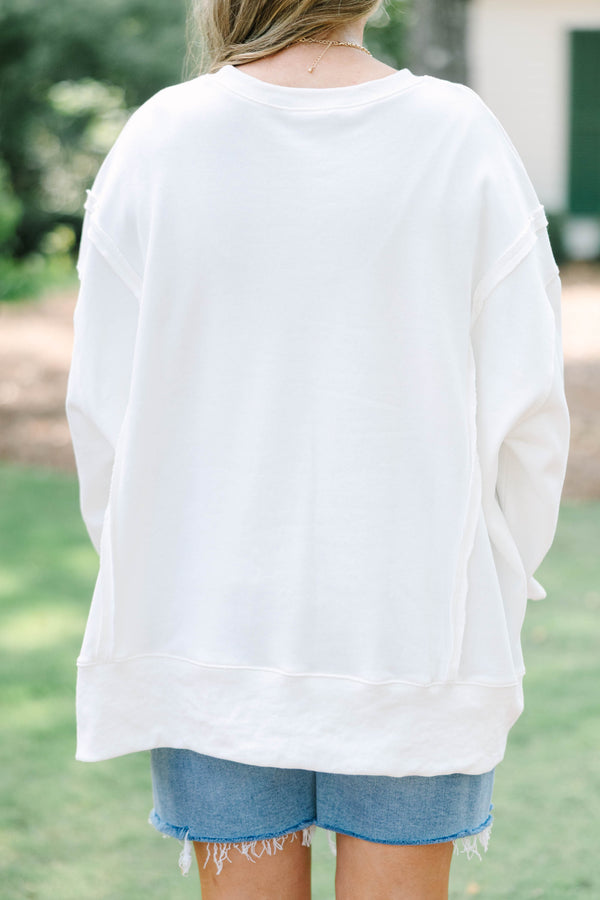 Plus size woman ivory sweatshirt with an orange and hot pink cheetah graphic 