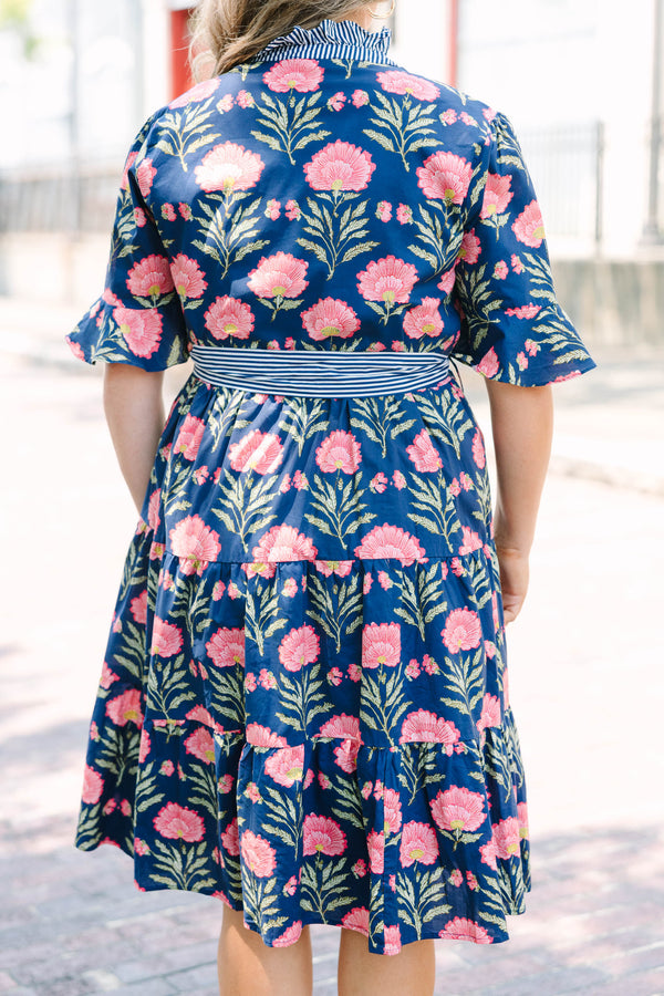 Plus Size navy floral dress with a striped ruffle neckline, button-front, and a striped waist sash.