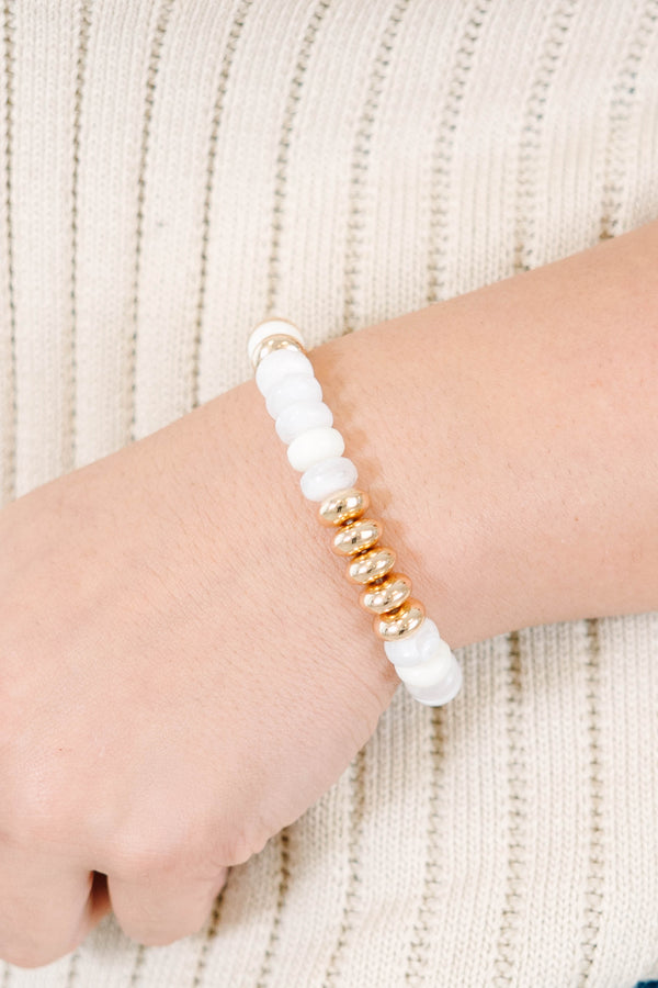 Halo Glow Bracelet featuring polished gold-toned  and crisp white beads.